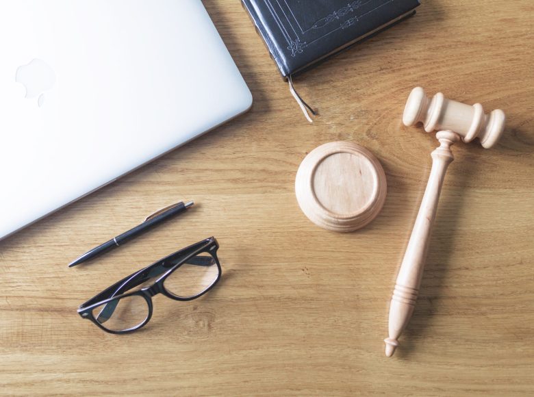 high-angle-view-laptop-spectacles-gavel-pen-wooden-background-wooden-desk high-angle-view-laptop-spectacles-gavel-pen-wooden-background-wooden-desk